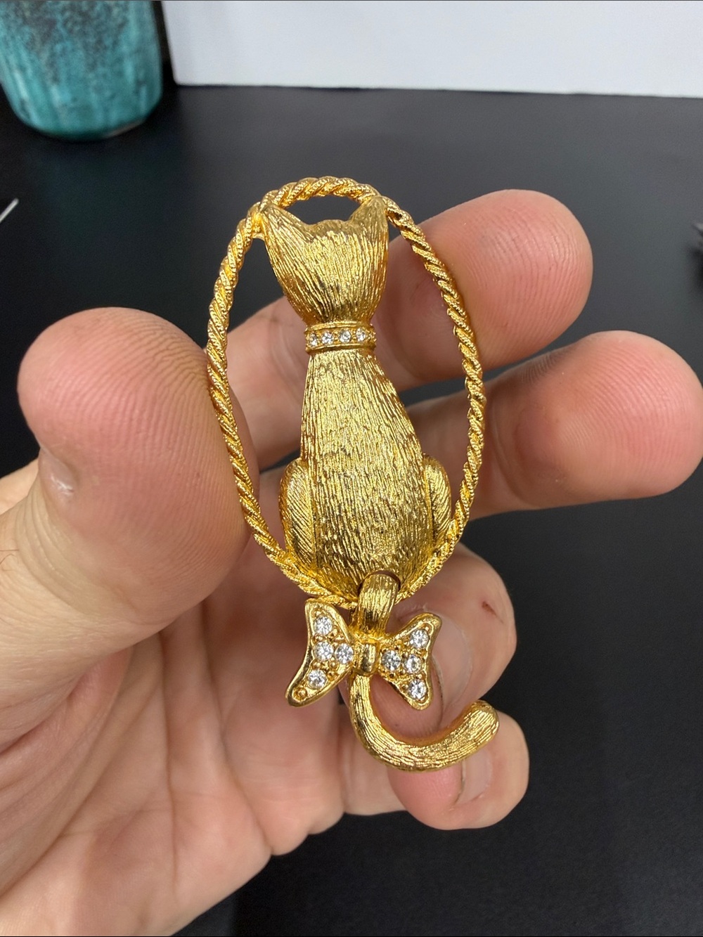 Gold-Tone Cat Brooch with Crystal Bow Accent